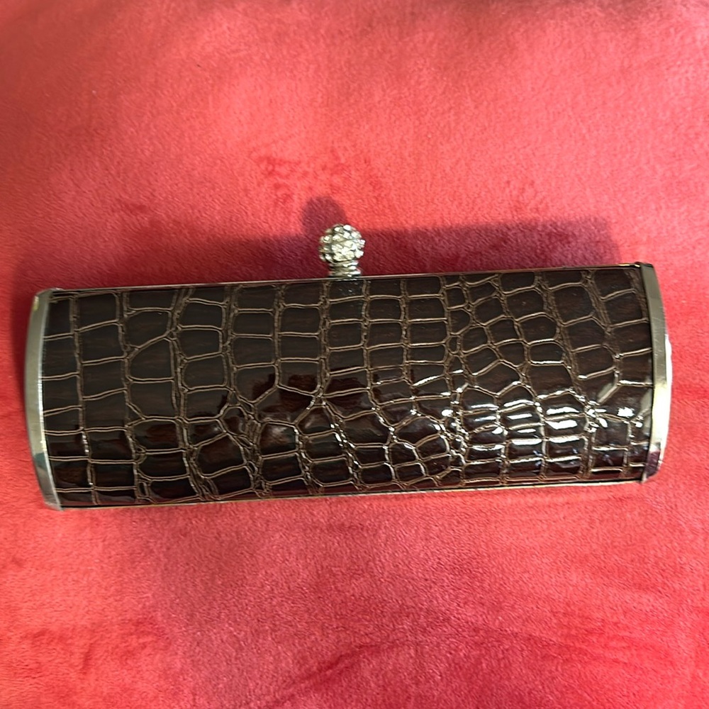 Brown and silver clutch